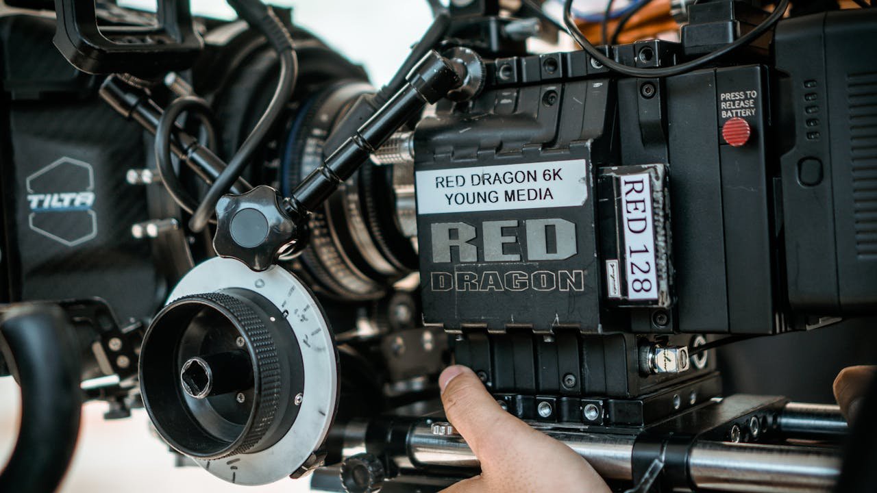 Detailed view of high-end RED camera setup used in professional filmmaking on set.